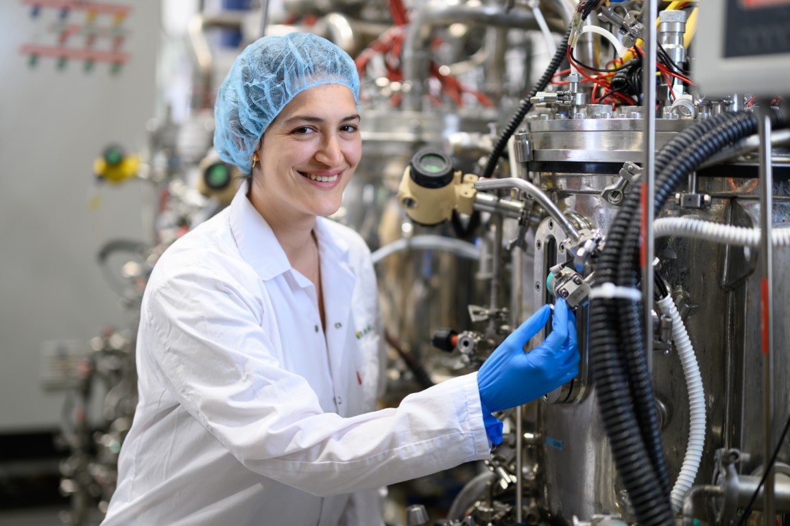 Brevel scientist inspecting fermentation bioreactor.